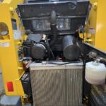 Detailed view of the engine compartment of a Gehl 4640 skid steer loader Ideal for buyers looking for a well-maintained skid steer in Western Canada