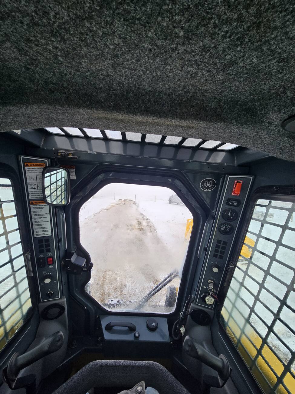 Interior shot from inside the Gehl 4640 skid steer loader Comfortable and well-maintained unit for sale in Western Canada.jpg