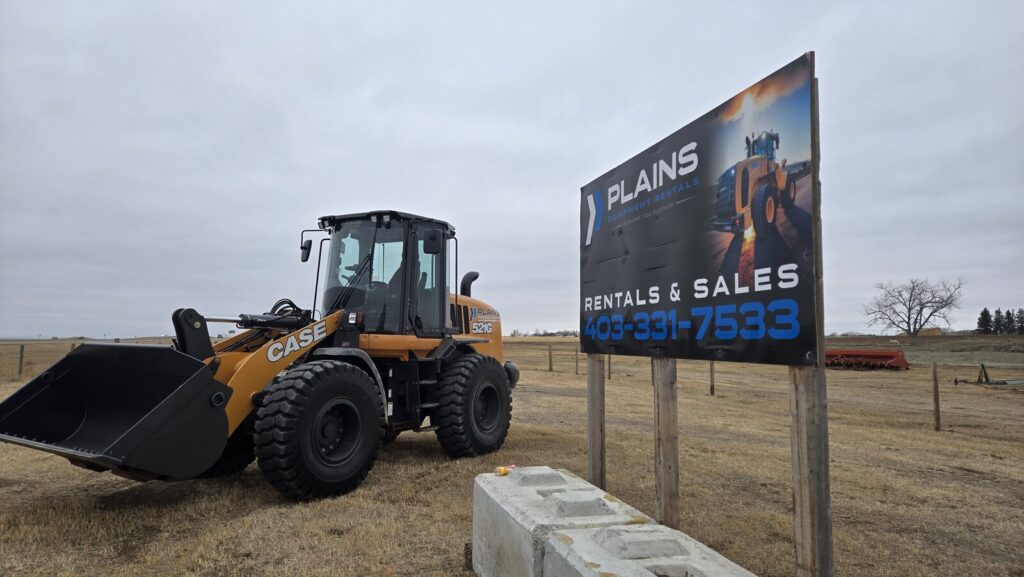 case-521g-wheel-loader-in-front-of-plains-equipment-rentals-sign-heavy-equipment-sales-and-rentals-alberta-canada