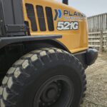 side-panel-and-tires-case-521g-wheel-loader-plains-equipment-rentals-logo-western-canada