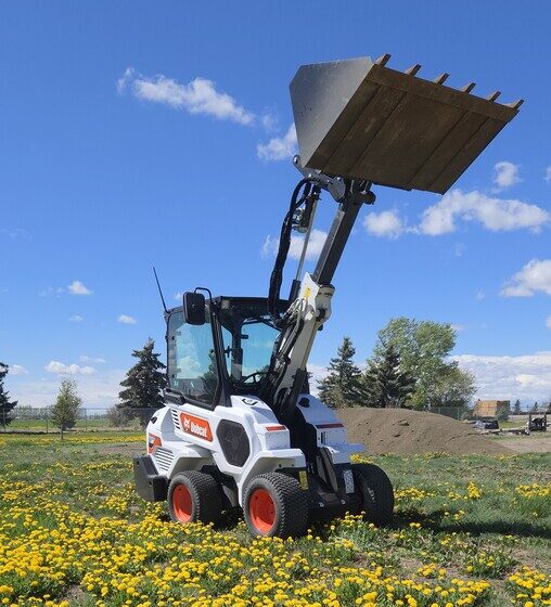 bobcat-l28-2022-loader-bucket-raised-field-of-flowers-for-sale-in-western-canada