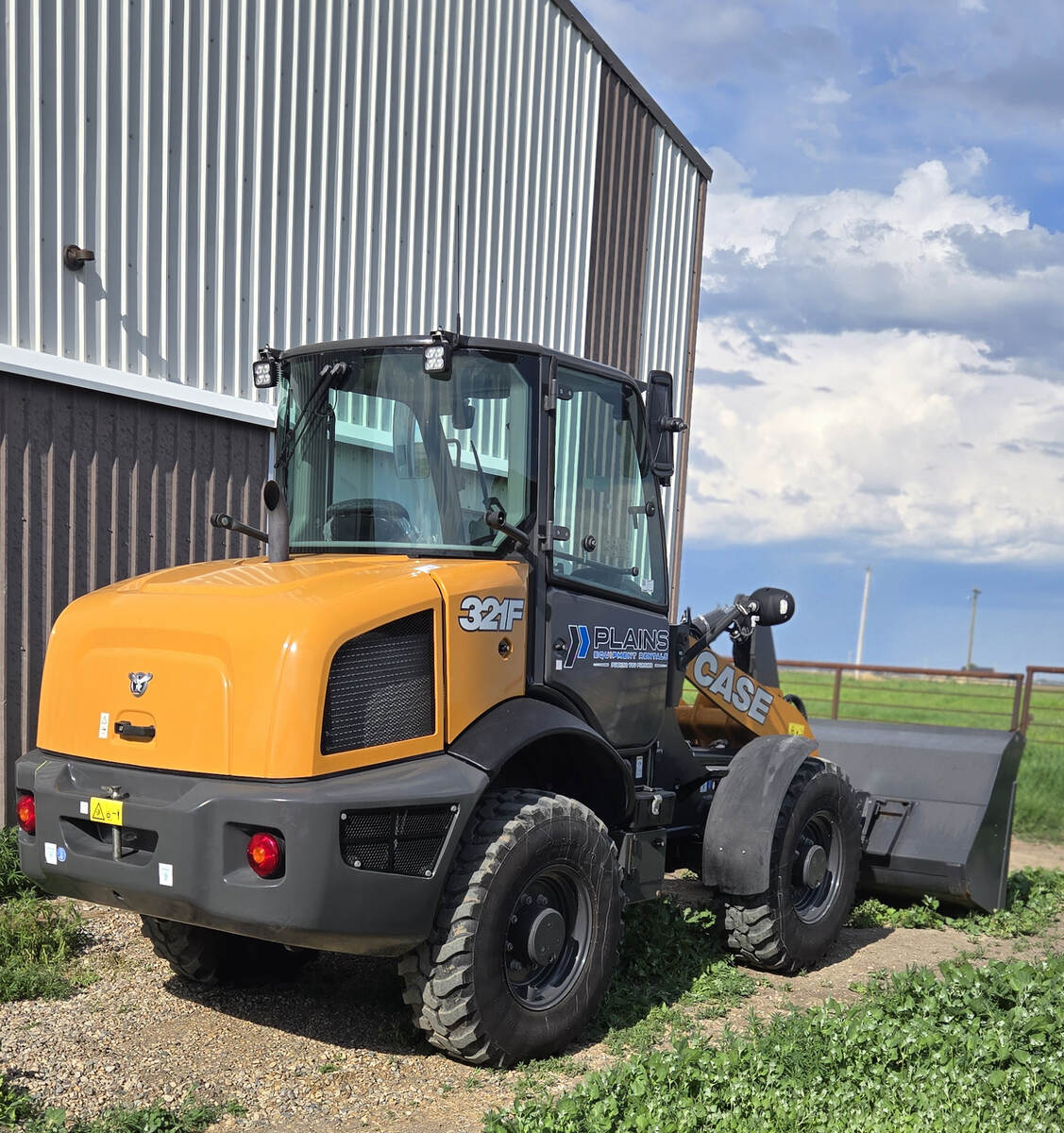 case-321f-rear-side-view-loader-parked-at-site-western-canada-plains-equipment