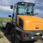 case-321f-wheel-loader-rear-quarter-view-with-cab-and-bucket-western-canada