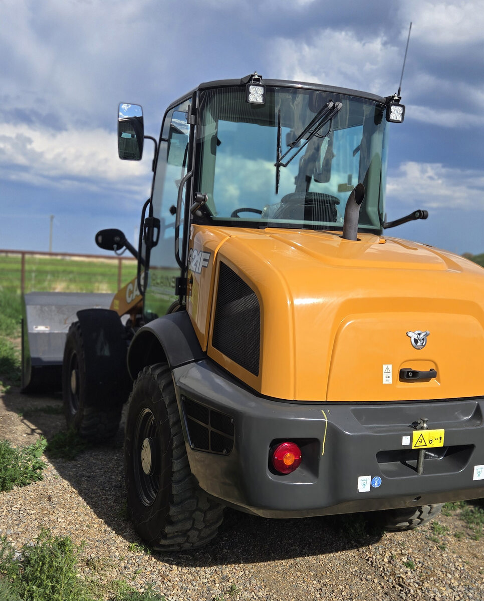 case-321f-wheel-loader-rear-quarter-view-with-cab-and-bucket-western-canada