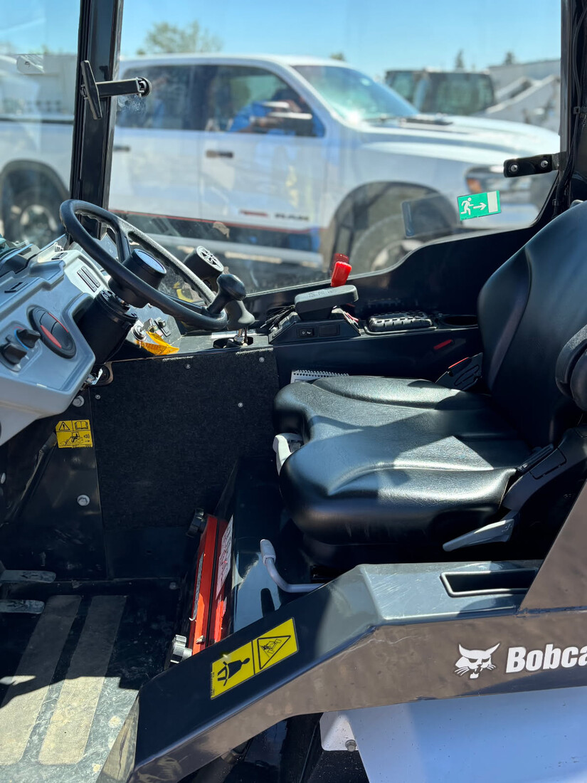 close-up-controls-seat-2022-bobcat-l28-loader-cabin-details-for-sale-western-canada