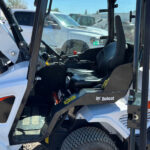 interior-cabin-bobcat-l28-2022-loader-operator-seat-and-controls-viewed-from-outside