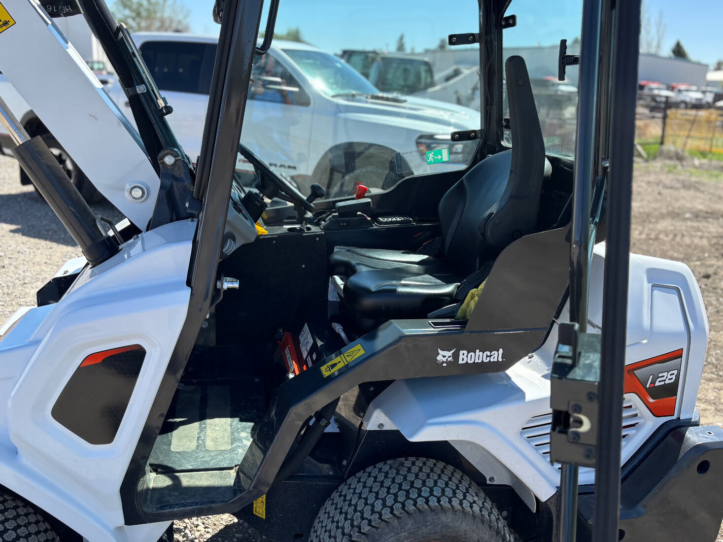 interior-cabin-bobcat-l28-2022-loader-operator-seat-and-controls-viewed-from-outside