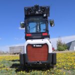 rear-view-2022-bobcat-l28-loader-with-cab-and-lift-arms-raised-for-sale-western-canada
