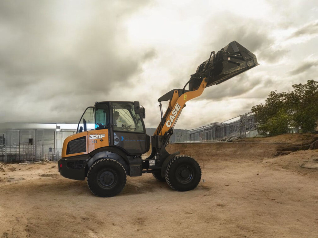 case-321f-compact-wheel-loader-with-raised-bucket-plains-equipment-rentals-western-canada