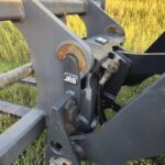 Close-up of JRB quick coupler attachment on John Deere 524K-II loader for sale in Western Canada