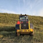 Rear view of John Deere 524K-II loader for sale from Plains Equipment Rentals in Canada
