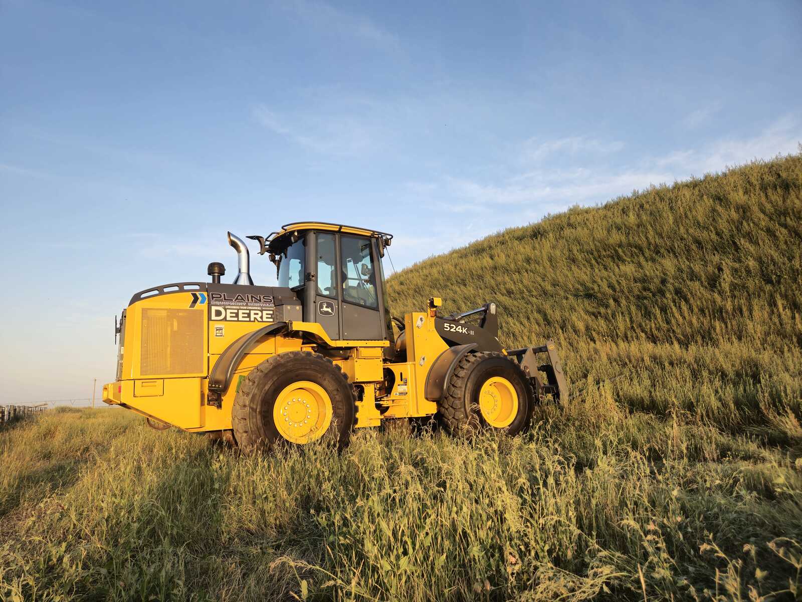 Side view of John Deere 524K II wheel loader from Plains Equipment Rentals in Western Canada for sale