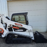 2023-bobcat-t595-skid-steer-side-profile-bucket-lowered-western-canada
