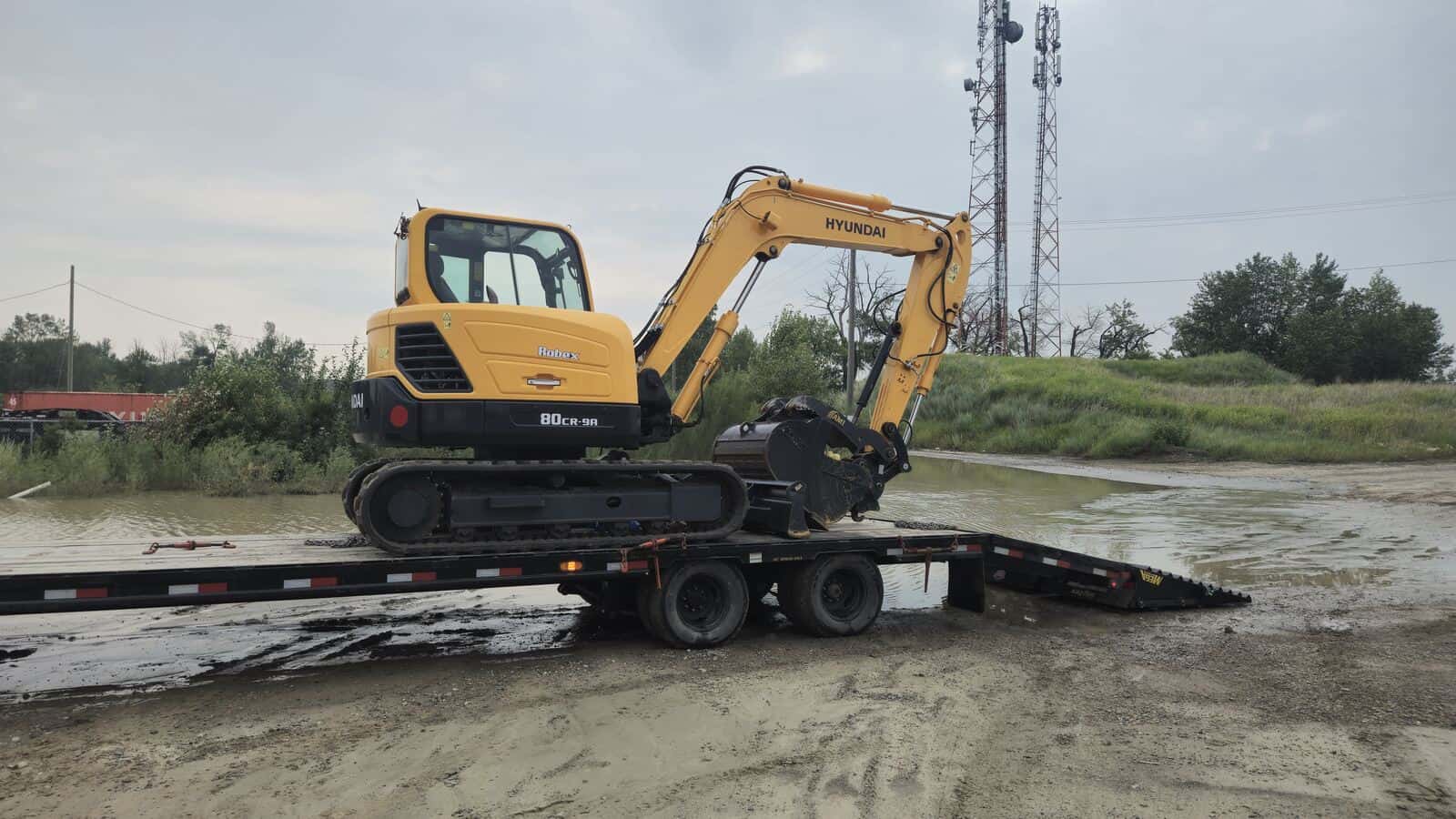 Hyundai 80CR-9A excavator loaded for transport in Western Canada