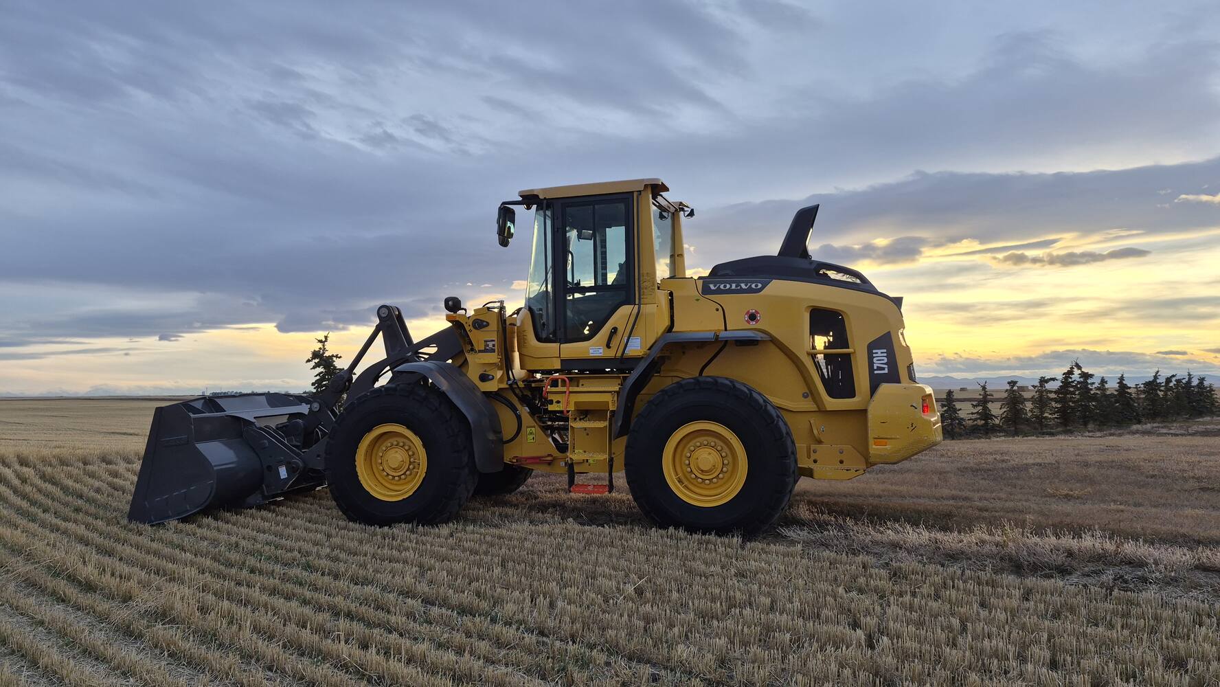 volvo-l70h-side-view-at-sunset-wheel-loader-for-sale-western-canada