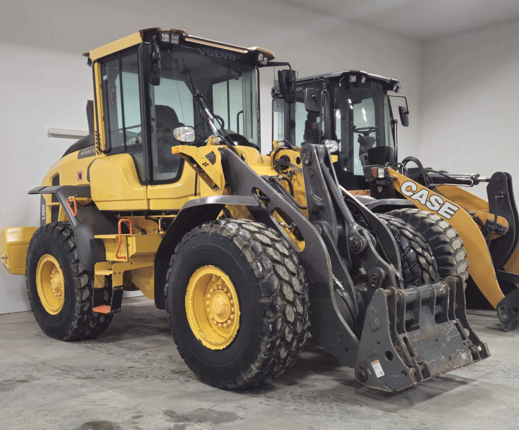 volvo-l70h-wheel-loader-with-bucket-next-to-case-loader-heavy-equipment-rental-western-canada
