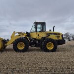 2010 Komatsu WA250-6 with front bucket at low angle showing bucket capacity