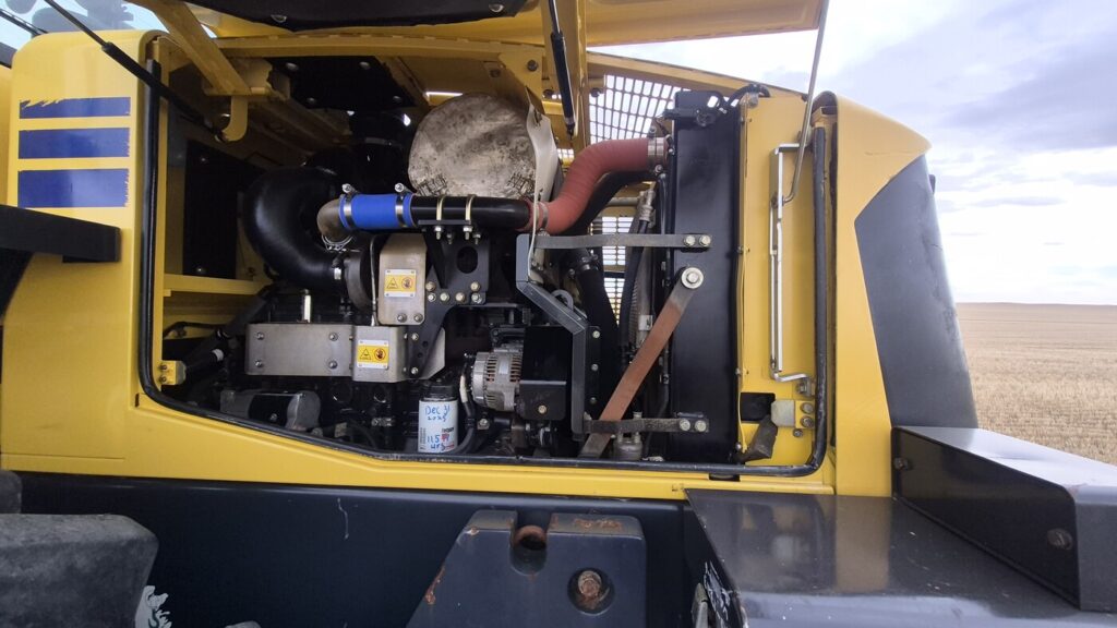 Left side engine compartment of 2010 Komatsu WA250-6 with panels open