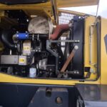 Left side engine compartment of 2010 Komatsu WA250-6 with panels open