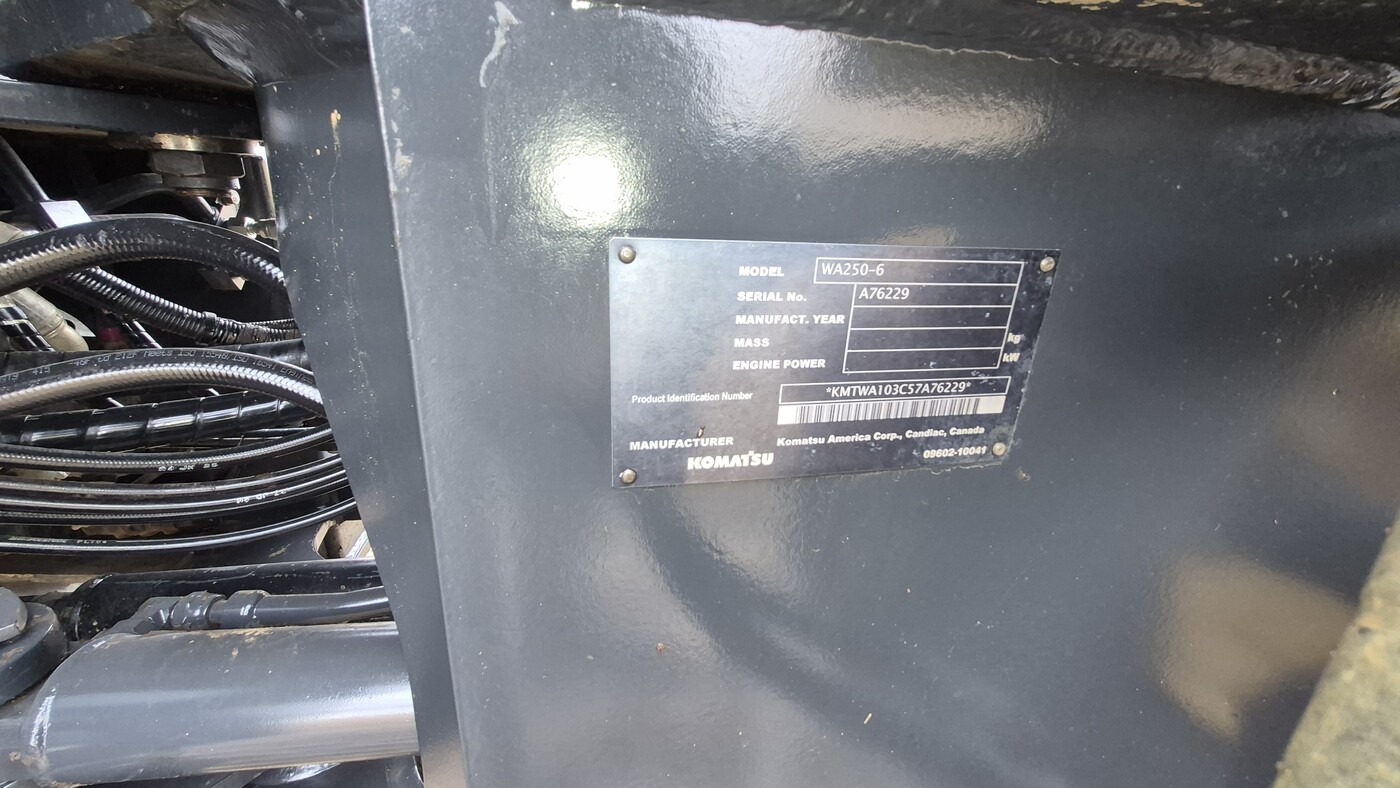 Model and serial plate on 2010 Komatsu WA250-6 frame