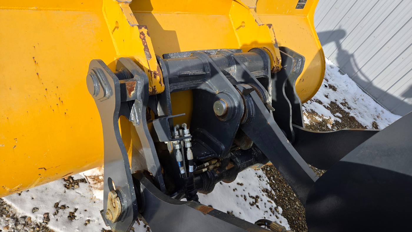 John Deere 444 P-tier snow plow bucket attachment for winter equipment rental services