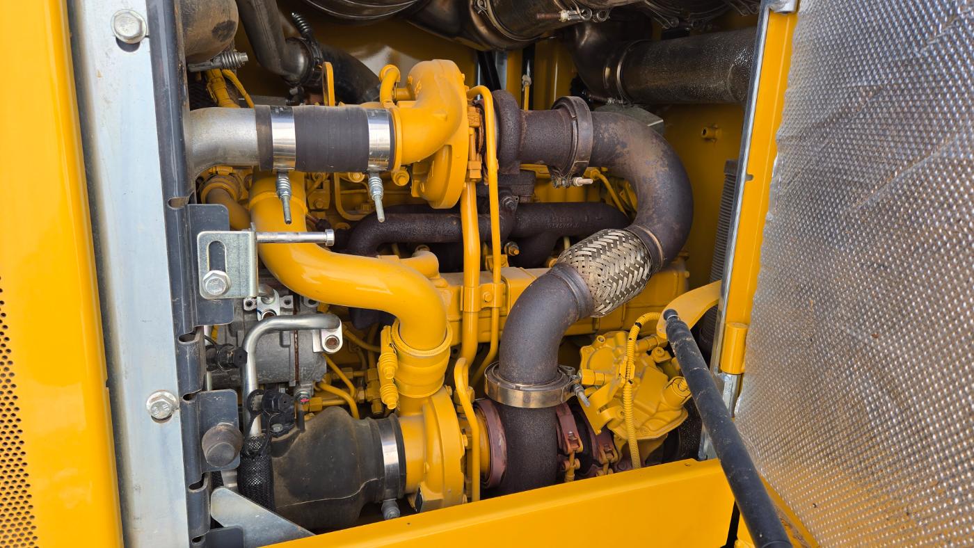 Close-up view of John Deere diesel engine in heavy machinery equipment