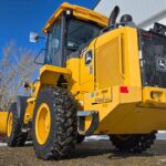 Yellow John Deere 444 wheel loader equipment rental machinery for western Canada operations