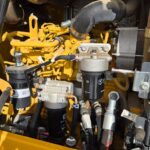 John Deere diesel engine with filters and hydraulic components for heavy equipment