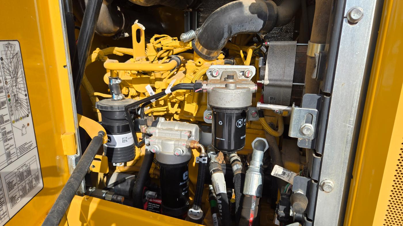 John Deere diesel engine with filters and hydraulic components for heavy equipment