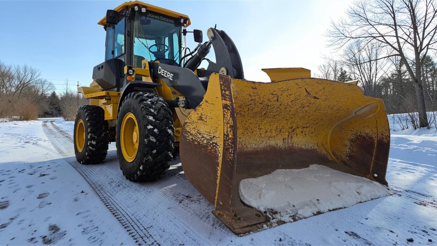 John Deere snow plow equipment for winter road maintenance in western Canada plains