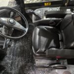 Komatsu WA250-6 wheel loader cabin interior showcasing equipment rental options