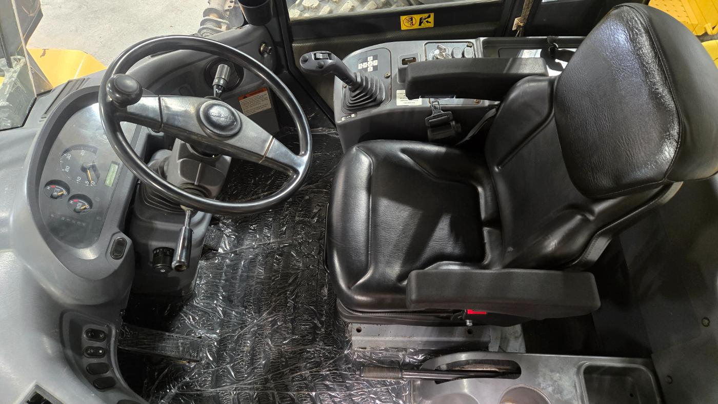 Komatsu WA250-6 wheel loader cabin interior showcasing equipment rental options