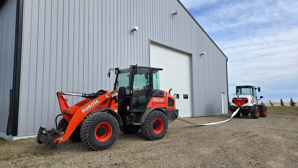 Kubota R640 and Bobcat L85 loaders outside Western Canada equipment facility
