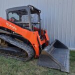 2021 Kubota SVL97-2 track skid steer for sale in Western Canada, front three quarter with bucket