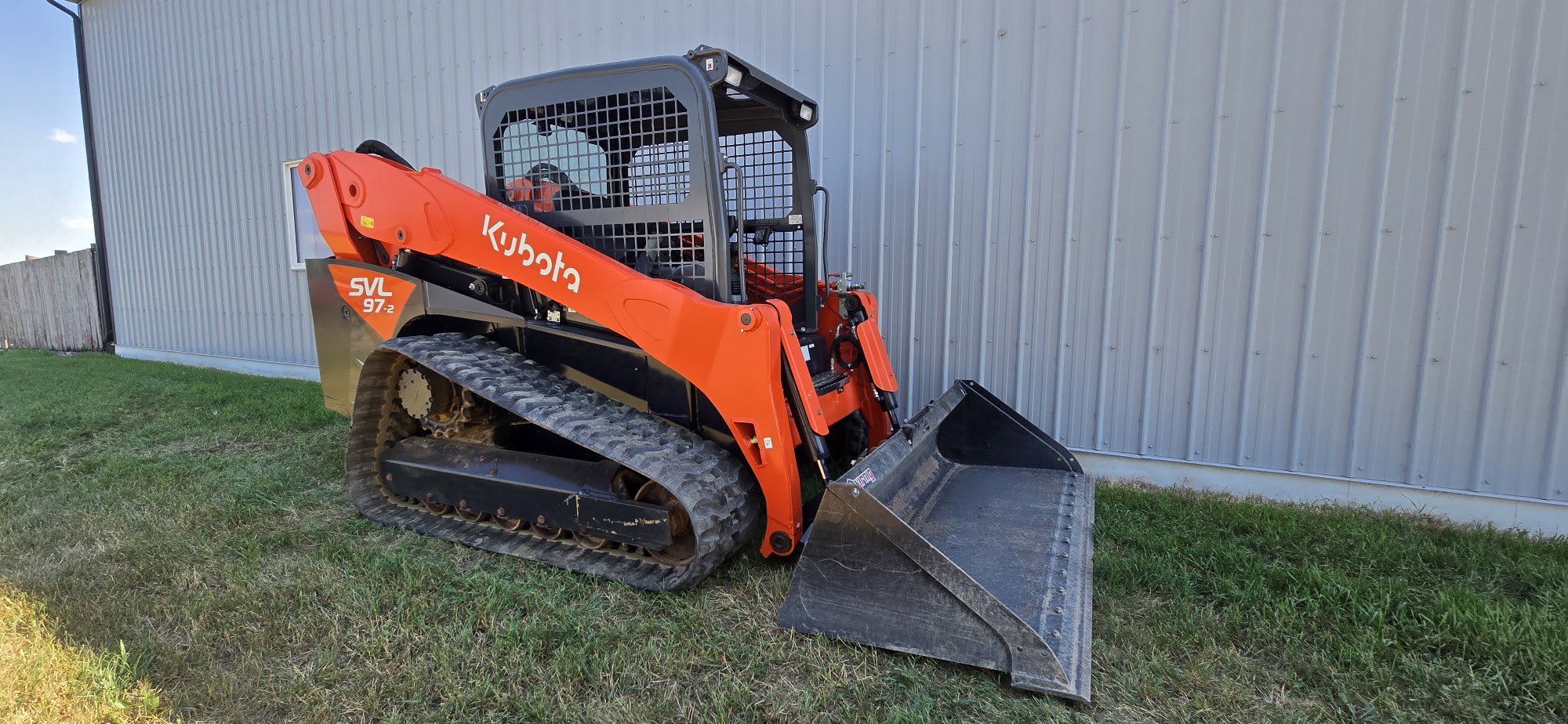 2021 Kubota SVL97-2 track skid steer for sale in Western Canada, front three quarter with bucket