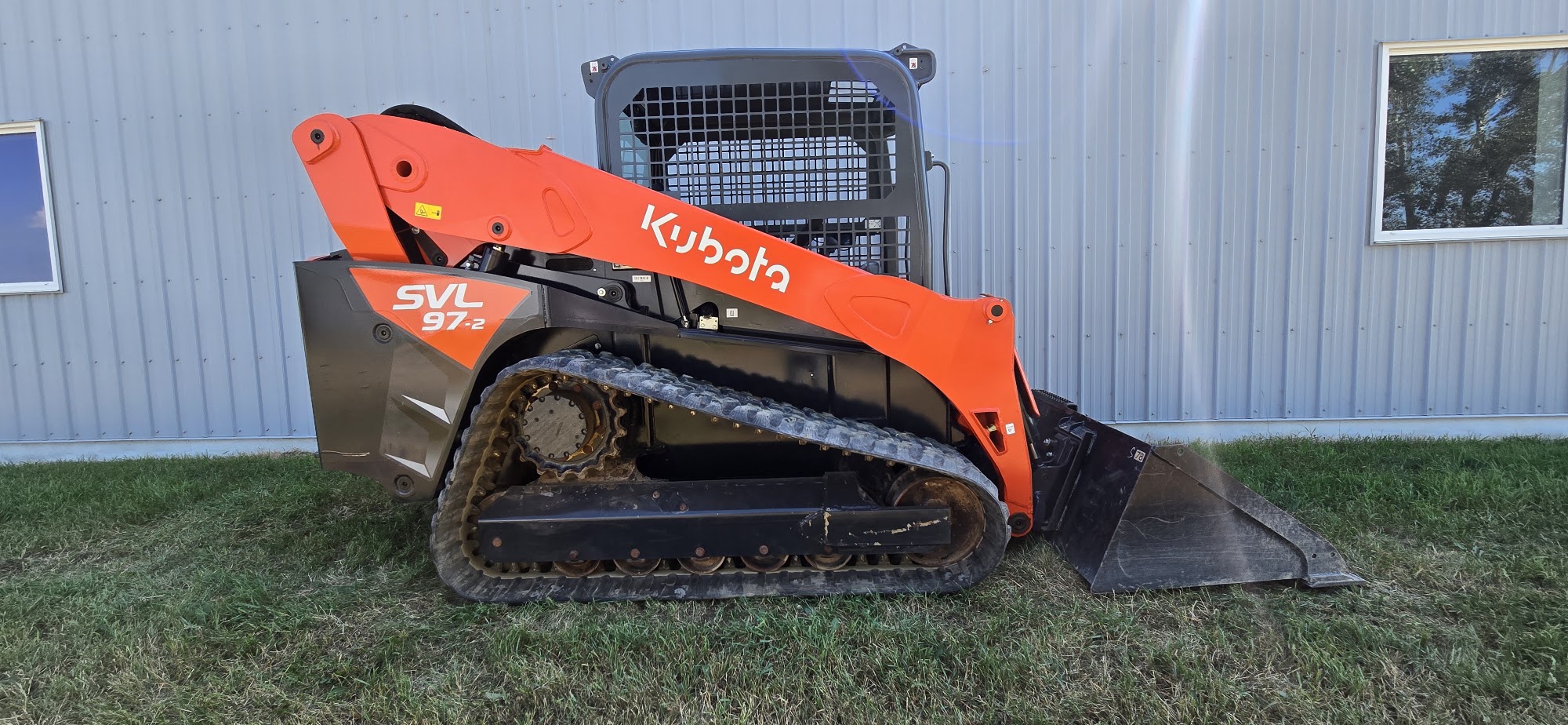 2021 Kubota SVL97-2 track skid steer for sale in Western Canada, side view loader arms