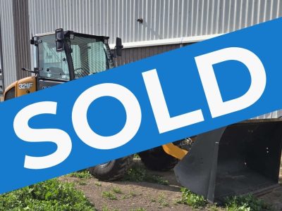 case-321f-wheel-loader-side-profile-near-building-western-canada-construction-equipment-sold